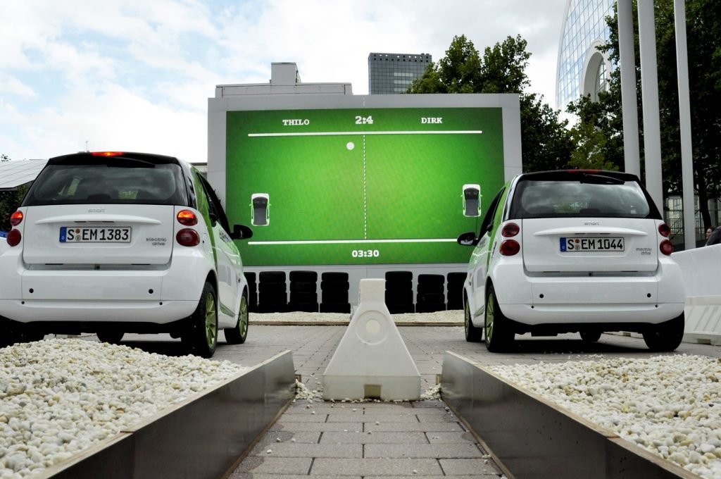 Two cars using an event gamification app